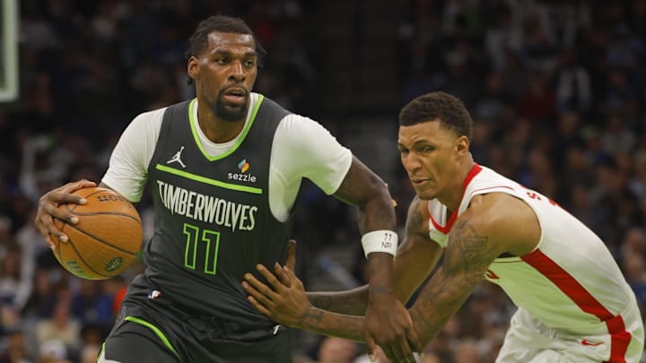 Nov 26, 2024; Minneapolis, Minnesota, USA; Minnesota Timberwolves center Naz Reid (11) drives past Houston Rockets forward Jabari Smith (10) in the fourth quarter at Target Center. Mandatory Credit: Bruce Kluckhohn-Imagn Images Nov 26, 2024; Minneapolis, Minnesota, USA; Minnesota Timberwolves center Naz Reid (11) drives past Houston Rockets forward Jabari Smith (10) in the fourth quarter at Target Center. Mandatory Credit: Bruce Kluckhohn-Imagn Images