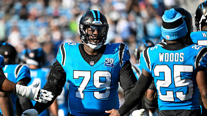 Oct 13, 2024; Charlotte, North Carolina, USA; Carolina Panthers offensive tackle Ikem Ekwonu (79) is introduced before the game at Bank of America Stadium. 