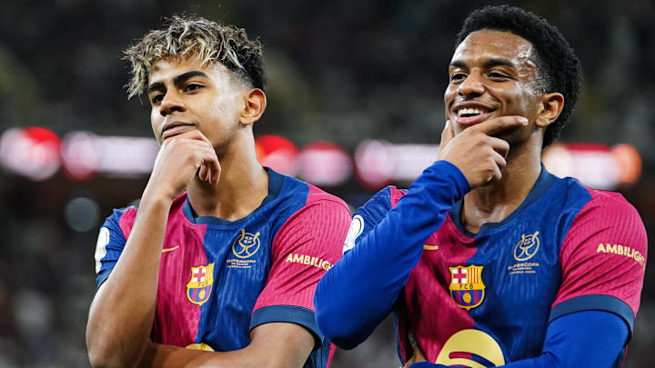 Barcelona's Spanish player Lamine Yamal (R) celebrates...