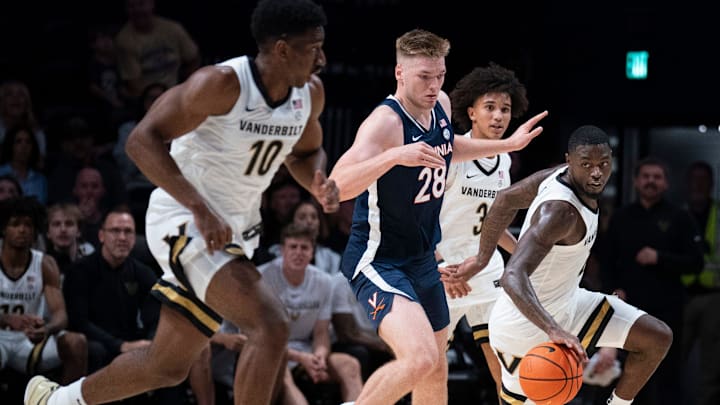 Vanderbilt guard Duke Miles (2) comes up with the ball after teammate guard Tyler Tanner (3) poked the ball away from Virginia forward Thijs De Ridder (28) during the first half of their exhibition game at Memorial Gym in Nashville, Tenn., Thursday, Oct. 16, 2025.