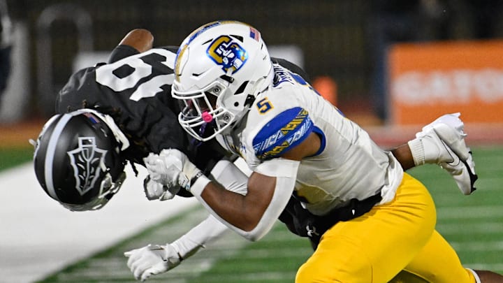 Dec 10, 2022; Mission Viejo, California, USA; Serra Padres Jabari Mann (5) tackles St. John Bosco