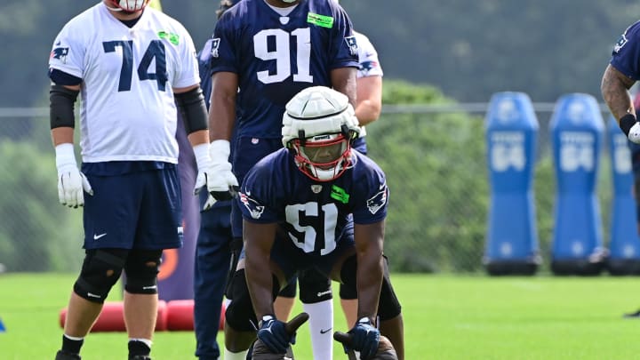 Jul 27, 2023; Foxborough, MA, USA; New England Patriots defensive end Keion White (51) works with a weight bag during training camp at Gillette Stadium. Mandatory Credit: Eric Canha-USA TODAY Sports