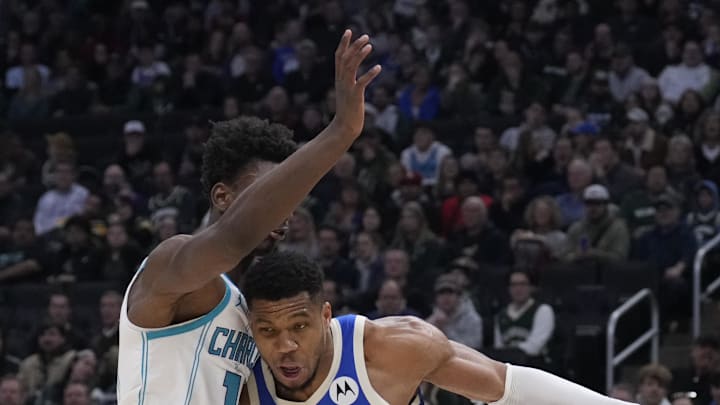 Nov 23, 2024; Milwaukee, Wisconsin, USA;  Milwaukee Bucks forward Giannis Antetokounmpo (34) drives to the basket against Charlotte Hornets forward Moussa Diabate (14) in the first half at Fiserv Forum. Mandatory Credit: Michael McLoone-Imagn Images