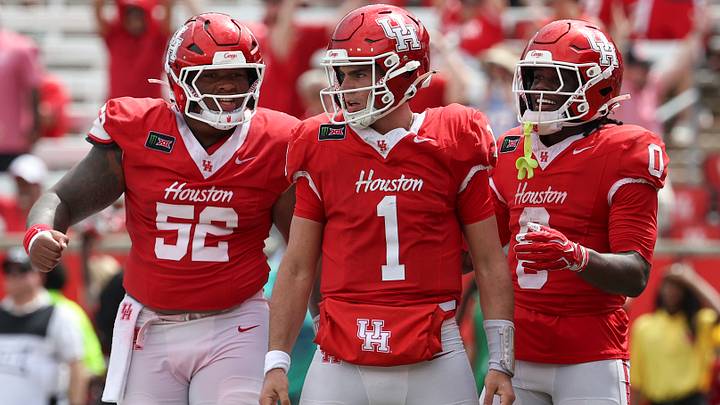 Sep 5, 2026; Houston, Texas, USA; Houston Cougars quarterback Conner Weigman (1) reacts with offensive lineman Anthony Boswell (52) and wide receiver Amare Thomas (0) after a play during the fourth quarter against the Oregon State Beavers at TDECU Stadium. Mandatory Credit: Troy Taormina-Imagn Images Sep 5, 2026; Houston, Texas, USA; Houston Cougars quarterback Conner Weigman (1) reacts with offensive lineman Anthony Boswell (52) and wide receiver Amare Thomas (0) after a play during the fourth quarter against the Oregon State Beavers at TDECU Stadium. Mandatory Credit: Troy Taormina-Imagn Images
