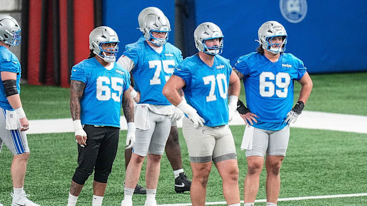 Detroit Lions offensive tackle Dan Skipper (70), center left, and guard Tate Ratledge (69) practice during OTA at Meijer Performance Center in Allen Park on Thursday, June 5, 2025.