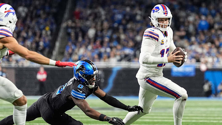 Buffalo Bills quarterback Josh Allen (17) runs against Detroit Lions cornerback Terrion Arnold (0) during the second half at Ford Field in Detroit on Sunday, Dec. 15, 2024. Buffalo Bills quarterback Josh Allen (17) runs against Detroit Lions cornerback Terrion Arnold (0) during the second half at Ford Field in Detroit on Sunday, Dec. 15, 2024.