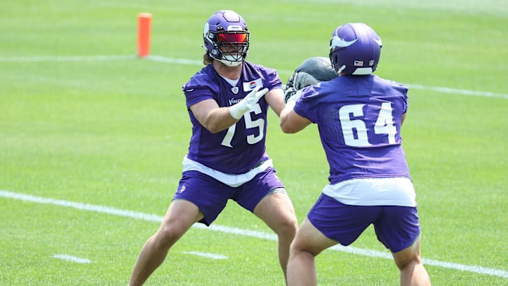 Jun 10, 2025; Minneapolis, MN, USA; Minnesota Vikings offensive tackle Brian O'Neill (75) and guard Blake Brandel (64) practice during minicamp at the Minnesota Vikings Training Facility.
