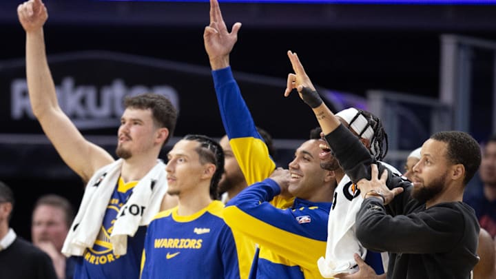 Jan 28, 2025; San Francisco, California, USA; The Golden State Warriors bench celebrates a three-point basket during the fourth quarter against the Utah Jazz at Chase Center. Mandatory Credit: D. Ross Cameron-Imagn Images