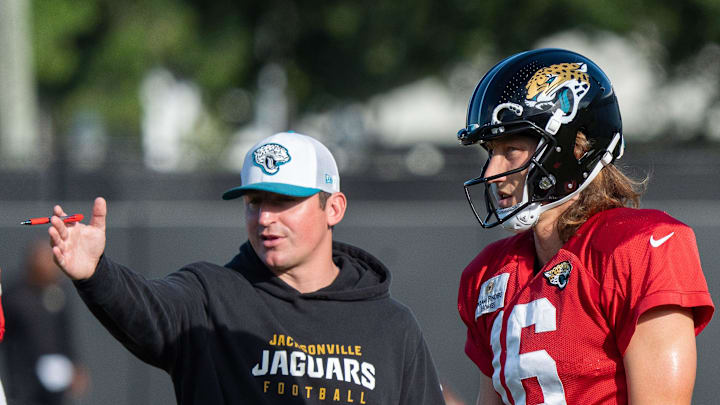 Jaguars Offensive Coordinator Grant Udinski talks with Jacksonville Jaguars quarterback Trevor Lawrence (16) during the Jaguars 14th NFL training camp session at Miller Electric Center Tuesday August 12, 2025 in Jacksonville, Fla. The Jaguars travel to New Orleans to play the Saints this Sunday in their second preseason game. [Doug Engle/Florida Times-Union]