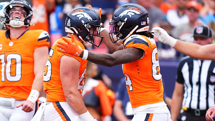 Oct 27, 2024; Denver, Colorado, USA; Denver Broncos tight end Nate Adkins (45) celebrates his touchdown with wide receiver Lil'Jordan Humphrey (84) in the second quarter against the Carolina Panthers at Empower Field at Mile High. 