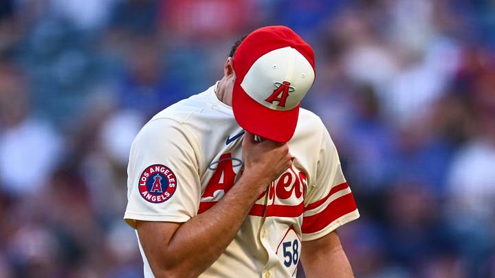 Aug 23, 2025; Anaheim, California, USA; Los Angeles Angels starting pitcher Victor Mederos (58) walks off the field against the Chicago Cubs during the first inning at Angel Stadium. Mandatory Credit: Jonathan Hui-Imagn Images