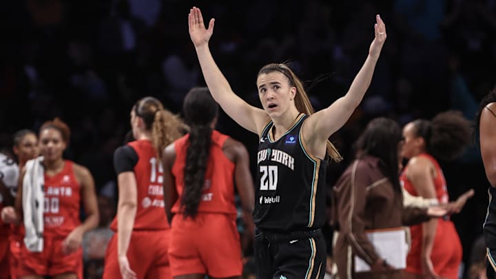 Sep 22, 2024; Brooklyn, New York, USA; New York Liberty guard Sabrina Ionescu (20) celebrates during a timeout against the Atlanta Dream during game one of the first round of the 2024 WNBA Playoffs at Barclays Center. Mandatory Credit: Wendell Cruz-Imagn Images Sep 22, 2024; Brooklyn, New York, USA; New York Liberty guard Sabrina Ionescu (20) celebrates during a timeout against the Atlanta Dream during game one of the first round of the 2024 WNBA Playoffs at Barclays Center. Mandatory Credit: Wendell Cruz-Imagn Images