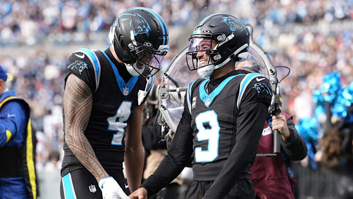 Dec 21, 2025; Charlotte, North Carolina, USA; Carolina Panthers wide receiver Tetairoa McMillan (4) and quarterback Bryce Young (9) celebrate after a play during the second half against the Tampa Bay Buccaneers at Bank of America Stadium. Mandatory Credit: Jim Dedmon-Imagn Images