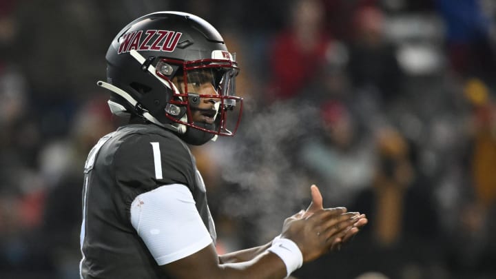 Nov 17, 2023; Pullman, Washington, USA; Washington State Cougars quarterback Cameron Ward (1) takes a snap during a game against the Colorado Buffaloes in the second half at Gesa Field at Martin Stadium. Washington State won 56-14. Mandatory Credit: James Snook-USA TODAY Sports