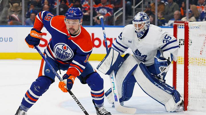 Mar 1, 2023; Edmonton, Alberta, CAN; Former Edmonton Oilers forward Devin Shore (19) tries to screen Toronto Maple Leafs goaltender Ilya Samsonov (35) during the first period at Rogers Place. Mandatory Credit: Perry Nelson-USA TODAY Sports