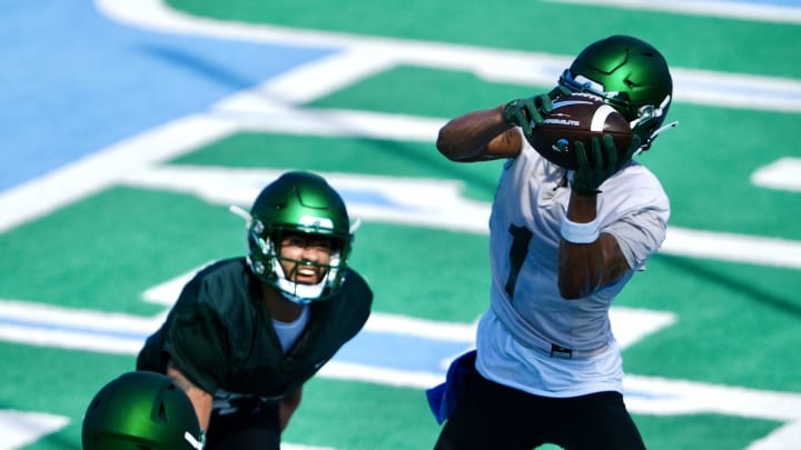 Dontae Fleming (1 in white) makes a touchdown grab during Fall Camp.