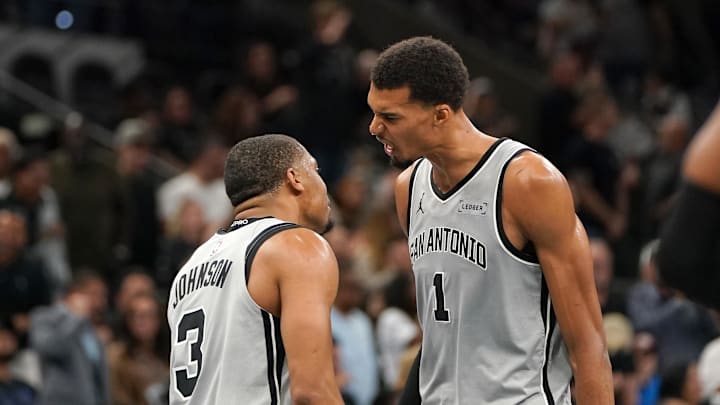 Nov 7, 2025; San Antonio, Texas, USA;  San Antonio Spurs forward Victor Wembanyama (1) and San Antonio Spurs forward Keldon Johnson (3) react after gaining the lead at the end of the second quarter against the Houston Rockets at Frost Bank Center. Mandatory Credit: Dustin Safranek-Imagn Images