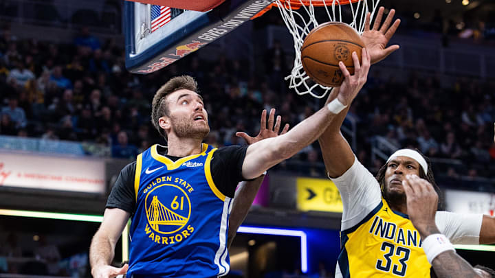Jan 10, 2025; Indianapolis, Indiana, USA; Golden State Warriors guard Pat Spencer (61) shoots the ball while Indiana Pacers center Myles Turner (33) defends in the first half at Gainbridge Fieldhouse. Mandatory Credit: Trevor Ruszkowski-Imagn Images