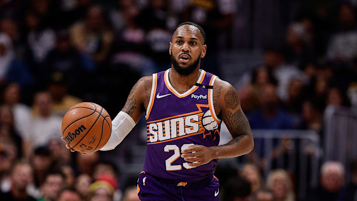 Oct 13, 2024; Denver, Colorado, USA; Phoenix Suns guard Monte Morris (23) dribbles the ball up court in the first quarter against the Denver Nuggets at Ball Arena. Mandatory Credit: Isaiah J. Downing-Imagn Images