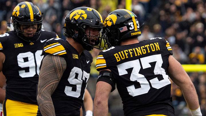 Iowa Hawkeyes defensive end Iose Epenesa (97) celebrates with Iowa Hawkeyes linebacker Cam Buffington (33) Oct. 31, 2026 during a Big Ten football game against the Wisconsin Badgers at Kinnick Stadium in Iowa City, Iowa.
