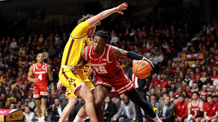 Mar 5, 2025; Minneapolis, Minnesota, USA; Wisconsin Badgers guard John Blackwell (25) works around Minnesota Golden Gophers guard Lu'Cye Patterson (25) during the second half at Williams Arena. Mar 5, 2025; Minneapolis, Minnesota, USA; Wisconsin Badgers guard John Blackwell (25) works around Minnesota Golden Gophers guard Lu'Cye Patterson (25) during the second half at Williams Arena.