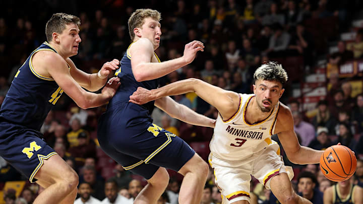 Jan 16, 2025; Minneapolis, Minnesota, USA; Minnesota Golden Gophers forward Dawson Garcia (3) works around Michigan Wolverines center Danny Wolf (1) during the first half at Williams Arena. Mandatory Credit: Matt Krohn-Imagn Images Jan 16, 2025; Minneapolis, Minnesota, USA; Minnesota Golden Gophers forward Dawson Garcia (3) works around Michigan Wolverines center Danny Wolf (1) during the first half at Williams Arena. Mandatory Credit: Matt Krohn-Imagn Images