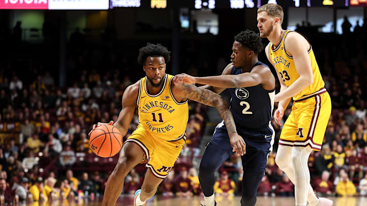 Feb 22, 2025; Minneapolis, Minnesota, USA; Minnesota Golden Gophers guard Femi Odukale (11) works around Penn State Nittany Lions guard D'Marco Dunn (2) during the first half at Williams Arena. Mandatory Credit: Matt Krohn-Imagn Images Feb 22, 2025; Minneapolis, Minnesota, USA; Minnesota Golden Gophers guard Femi Odukale (11) works around Penn State Nittany Lions guard D'Marco Dunn (2) during the first half at Williams Arena. Mandatory Credit: Matt Krohn-Imagn Images