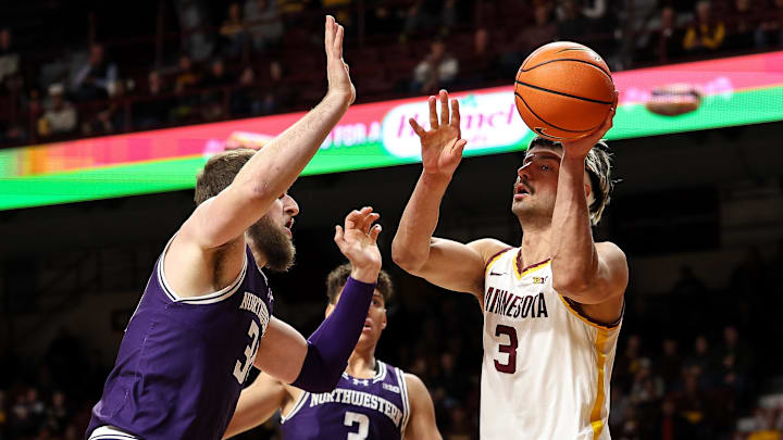 Feb 25, 2025; Minneapolis, Minnesota, USA; Minnesota Golden Gophers forward Dawson Garcia (3) shoots as Northwestern Wildcats center Matthew Nicholson (34) defends during the first half at Williams Arena. Mandatory Credit: Matt Krohn-Imagn Images