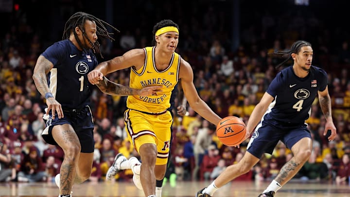 Feb 22, 2025; Minneapolis, Minnesota, USA; Minnesota Golden Gophers guard Isaac Asuma (1) drives towards the basket as Penn State Nittany Lions guard Ace Baldwin Jr. (1) defends during the first half at Williams Arena. Mandatory Credit: Matt Krohn-Imagn Images