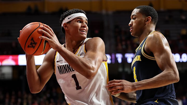 Jan 16, 2025; Minneapolis, Minnesota, USA; Minnesota Golden Gophers guard Isaac Asuma (1) inbounds the ball as Michigan Wolverines guard Nimari Burnett (4) defends during the second half at Williams Arena. Mandatory Credit: Matt Krohn-Imagn Images