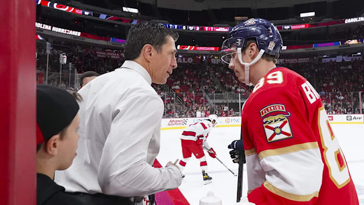 Sep 27, 2023; Raleigh, North Carolina, USA; Carolina Hurricanes head coach Rod Brind   Amour talks to his son Florida Panthers forward Skyler Brind'Amour (89) before the game at PNC Arena. Mandatory Credit: James Guillory-Imagn Images