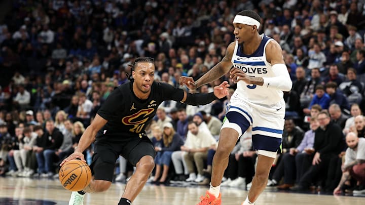 Jan 18, 2025; Minneapolis, Minnesota, USA; Cleveland Cavaliers guard Darius Garland (10) works around Minnesota Timberwolves forward Jaden McDaniels (3) during the third quarter at Target Center. Mandatory Credit: Matt Krohn-Imagn Images