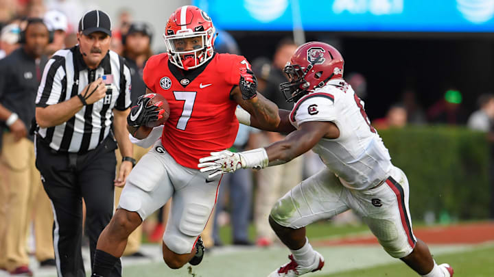Nov 4, 2017; Athens, GA, USA; Georgia Bulldogs running back D'Andre Swift (7) runs against South Carolina Gamecocks linebacker T.J. Brunson (6) during the second half at Sanford Stadium. Mandatory Credit: Dale Zanine-Imagn Images