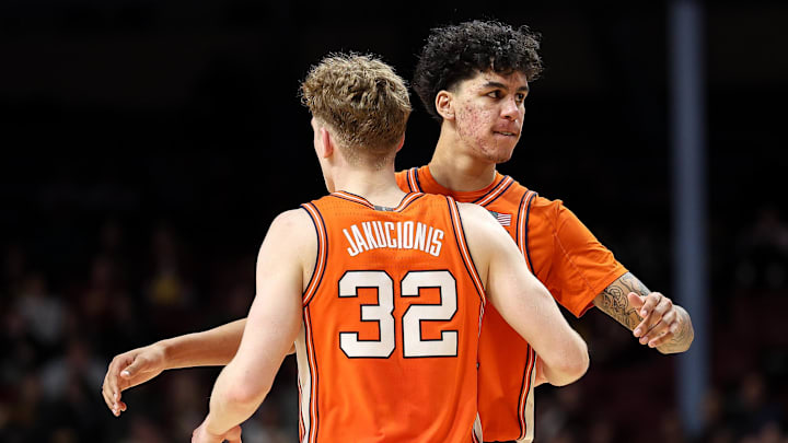 Feb 8, 2025; Minneapolis, Minnesota, USA; Illinois Fighting Illini forward Will Riley (7) and guard Kasparas Jakucionis (32) celebrate during the second half against the Minnesota Golden Gophers at Williams Arena. Mandatory Credit: Matt Krohn-Imagn Images