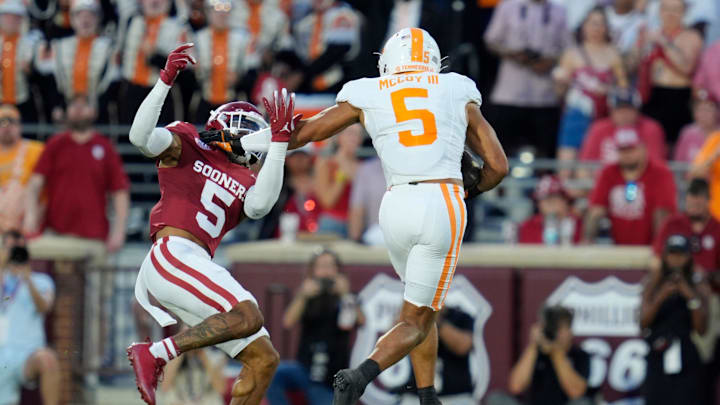 Tennessee Volunteers wide receiver Bru McCoy (5) runs past Oklahoma Sooners defensive back Woodi Washington (5) during a college football game between the University of Oklahoma Sooners (OU) and the Tennessee Volunteers at Gaylord Family - Oklahoma Memorial Stadium in Norman, Okla., Saturday, Sept. 21, 2024. Tennessee Volunteers wide receiver Bru McCoy (5) runs past Oklahoma Sooners defensive back Woodi Washington (5) during a college football game between the University of Oklahoma Sooners (OU) and the Tennessee Volunteers at Gaylord Family - Oklahoma Memorial Stadium in Norman, Okla., Saturday, Sept. 21, 2024.
