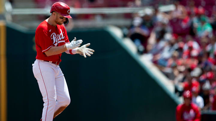 Cincinnati Reds third baseman Brandon Drury (22) claps after reaching first on a base hit.