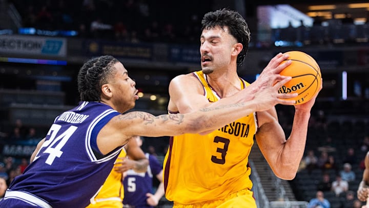 Mar 12, 2025; Indianapolis, IN, USA; Minnesota Golden Gophers forward Dawson Garcia (3) shoots the ball while Northwestern Wildcats guard K.J. Windham (24) defends in the second half at Gainbridge Fieldhouse. Mandatory Credit: Trevor Ruszkowski-Imagn Images Mar 12, 2025; Indianapolis, IN, USA; Minnesota Golden Gophers forward Dawson Garcia (3) shoots the ball while Northwestern Wildcats guard K.J. Windham (24) defends in the second half at Gainbridge Fieldhouse. Mandatory Credit: Trevor Ruszkowski-Imagn Images