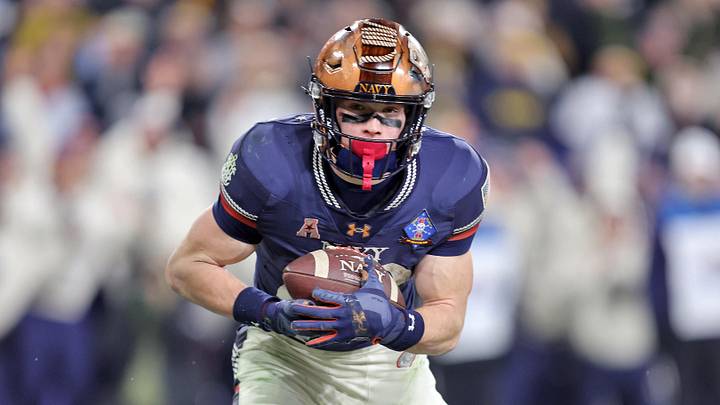 Dec 13, 2025; Baltimore, Maryland, USA; Navy Midshipmen slotback Eli Heidenreich (22) catches a pass for a touchdown against the Army Black Knights during the second half of the 126th Army-Navy game at M&T Bank Stadium. Mandatory Credit: Danny Wild-Imagn Images Dec 13, 2025; Baltimore, Maryland, USA; Navy Midshipmen slotback Eli Heidenreich (22) catches a pass for a touchdown against the Army Black Knights during the second half of the 126th Army-Navy game at M&T Bank Stadium. Mandatory Credit: Danny Wild-Imagn Images