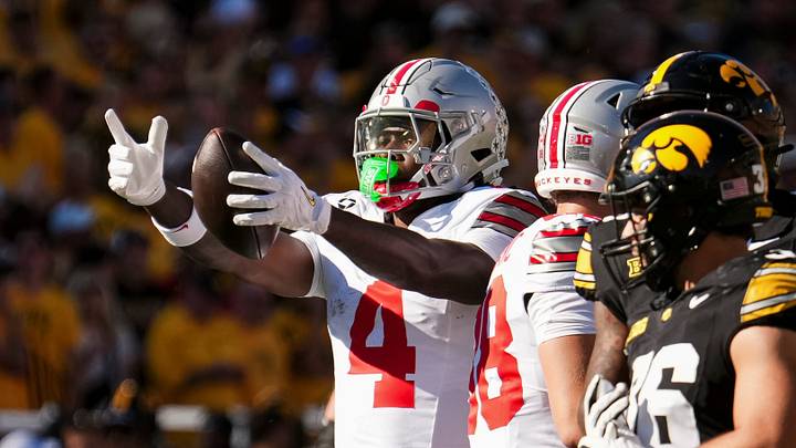 Ohio State Buckeyes wide receiver Jeremiah Smith (4) reacts to a first down catch during the NCAA football game against the Iowa Hawkeyes at Kinnick Stadium in Iowa City on Oct. 3, 2026. Ohio State Buckeyes wide receiver Jeremiah Smith (4) reacts to a first down catch during the NCAA football game against the Iowa Hawkeyes at Kinnick Stadium in Iowa City on Oct. 3, 2026.