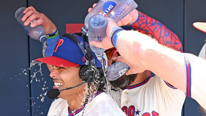 Sep 7, 2026; Philadelphia, Pennsylvania, USA; Philadelphia Phillies pitcher Jesús Luzardo (44) is doused with water by designated hitter Kyle Schwarber (12) and left fielder Brandon Marsh (16) after his complete game two-hit shutout against the Atlanta Braves at Citizens Bank Park. Mandatory Credit: Eric Hartline-Imagn Images