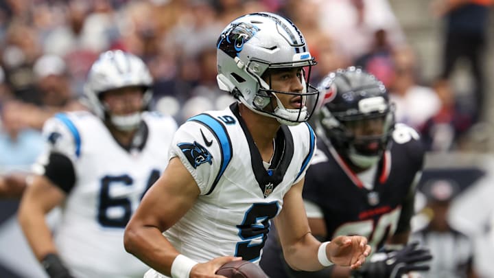 Aug 16, 2025; Houston, Texas, USA; Carolina Panthers quarterback Bryce Young (9) scrambles against the Houston Texans in the first quarter at NRG Stadium. Mandatory Credit: Thomas Shea-Imagn Images