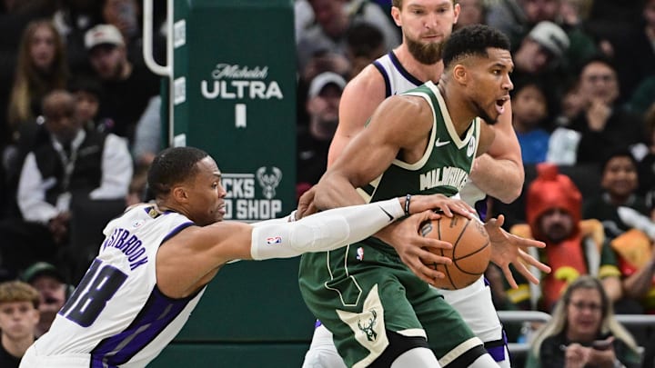 Nov 1, 2025; Milwaukee, Wisconsin, USA; Sacramento Kings guard Russell Westbrook (18) vies for the ball against Milwaukee Bucks forward Giannis Antetokounmpo (34) in the fourth quarter at Fiserv Forum. Mandatory Credit: Benny Sieu-Imagn Images Nov 1, 2025; Milwaukee, Wisconsin, USA; Sacramento Kings guard Russell Westbrook (18) vies for the ball against Milwaukee Bucks forward Giannis Antetokounmpo (34) in the fourth quarter at Fiserv Forum. Mandatory Credit: Benny Sieu-Imagn Images