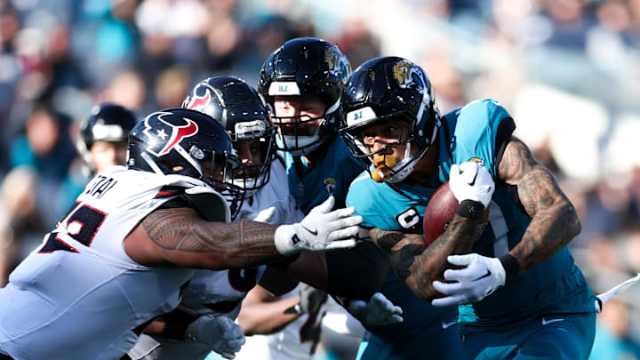 Dec 1, 2024; Jacksonville, Florida, USA; Jacksonville Jaguars tight end Evan Engram (17) runs with the ball against the Houston Texans in the third quarter at EverBank Stadium. Mandatory Credit: Nathan Ray Seebeck-Imagn Images