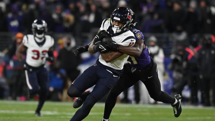 Jan 20, 2024; Baltimore, MD, USA; Houston Texans wide receiver Nico Collins (12) runs the ball against Baltimore Ravens cornerback Brandon Stephens (21) during the second quarter of a 2024 AFC divisional round game at M&T Bank Stadium. Mandatory Credit: Tommy Gilligan-USA TODAY Sports Jan 20, 2024; Baltimore, MD, USA; Houston Texans wide receiver Nico Collins (12) runs the ball against Baltimore Ravens cornerback Brandon Stephens (21) during the second quarter of a 2024 AFC divisional round game at M&T Bank Stadium. Mandatory Credit: Tommy Gilligan-USA TODAY Sports