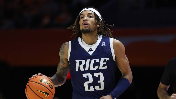 Nov 17, 2025; Knoxville, Tennessee, USA; Rice Owls guard Nick Anderson (23) brings the ball up court against the Tennessee Volunteers during the second half at Thompson-Boling Arena at Food City Center. Mandatory Credit: Randy Sartin-Imagn Images Nov 17, 2025; Knoxville, Tennessee, USA; Rice Owls guard Nick Anderson (23) brings the ball up court against the Tennessee Volunteers during the second half at Thompson-Boling Arena at Food City Center. Mandatory Credit: Randy Sartin-Imagn Images