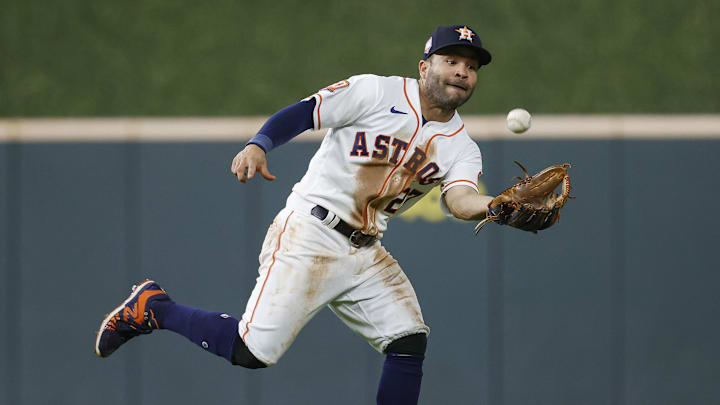 Houston, Texas, USA; Houston Astros second baseman Jose Altuve (27) catches a fly ball during the eighth inning against the Cleveland Guardians at Minute Maid Park.