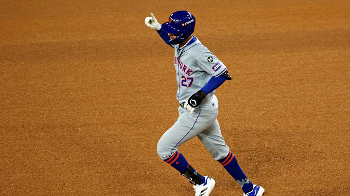 Oct 20, 2024; Los Angeles, California, USA; New York Mets third base Mark Vientos (27) celebrates after hitting a two run home run during the fourth inning against the Los Angeles Dodgers during game six of the NLCS for the 2024 MLB playoffs at Dodger Stadium. Mandatory Credit: Kiyoshi Mio-Imagn Images