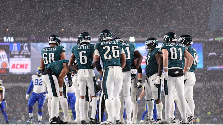 Jan 19, 2025; Philadelphia, Pennsylvania, USA; Philadelphia Eagles running back Saquon Barkley (26) and his team huddle up for a play against the Los Angeles Rams in a 2025 NFC divisional round game at Lincoln Financial Field. Mandatory Credit: Bill Streicher-Imagn Images