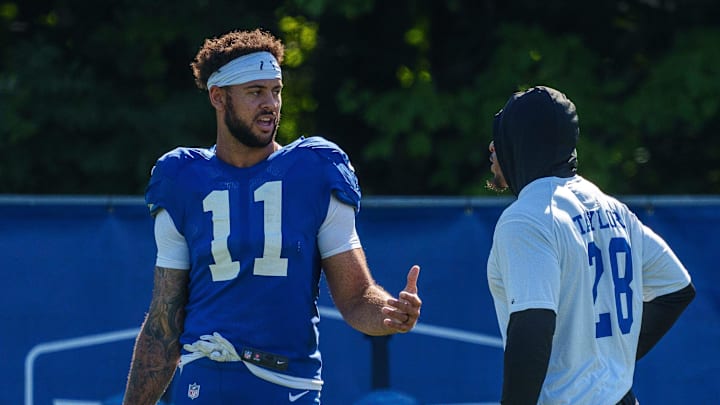 Indianapolis Colts wide receiver Michael Pittman Jr. (11) speaks with Indianapolis Colts running