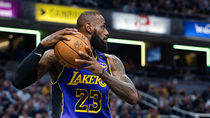 Mar 26, 2025; Indianapolis, Indiana, USA; Los Angeles Lakers forward LeBron James (23) rebounds the ball in the first half against the Indiana Pacers at Gainbridge Fieldhouse. Mandatory Credit: Trevor Ruszkowski-Imagn Images
